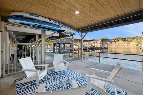 a view of a patio with table and chairs