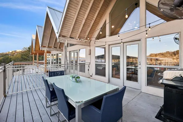 a view of a roof deck with wooden floor and outdoor space