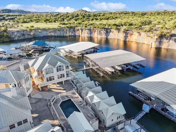 an aerial view of a house with a ocean view