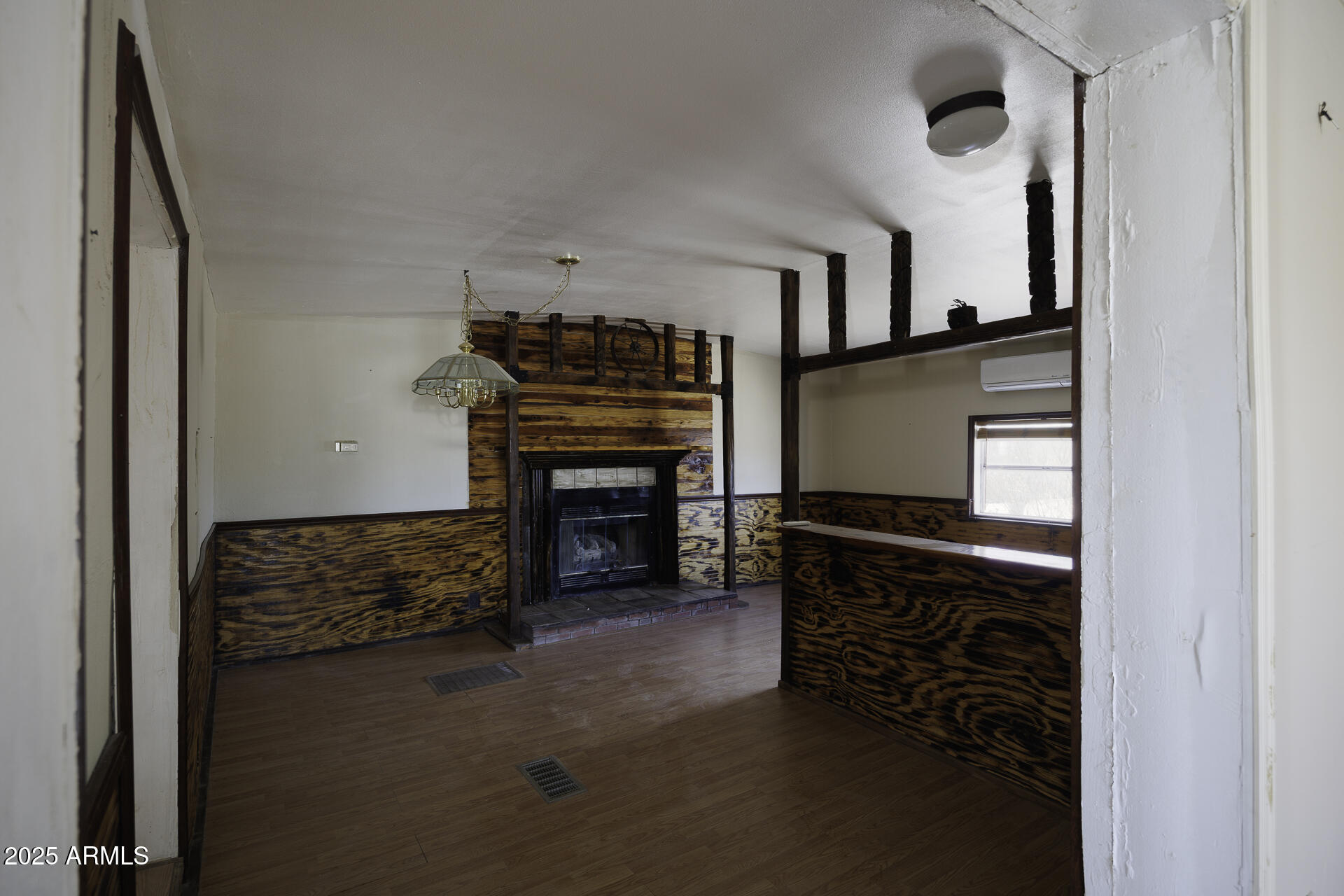 9505 West Milligan Road Arizona City, AZ 85123 - Photo 13 of 45 a living room with furniture a fireplace and a flat screen tv