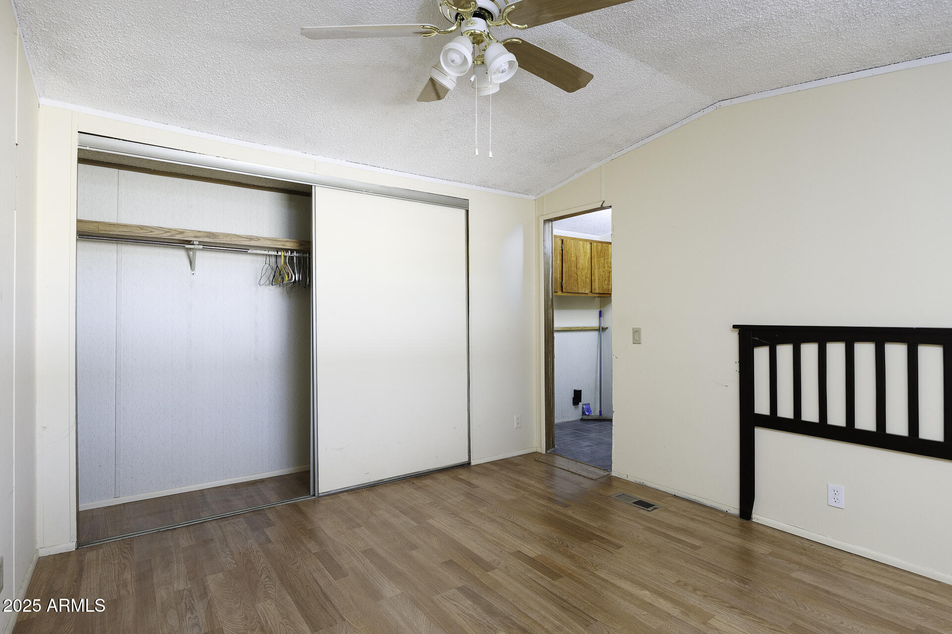 9505 West Milligan Road Arizona City, AZ 85123 - Photo 22 of 45 wooden floor in an empty room with a window