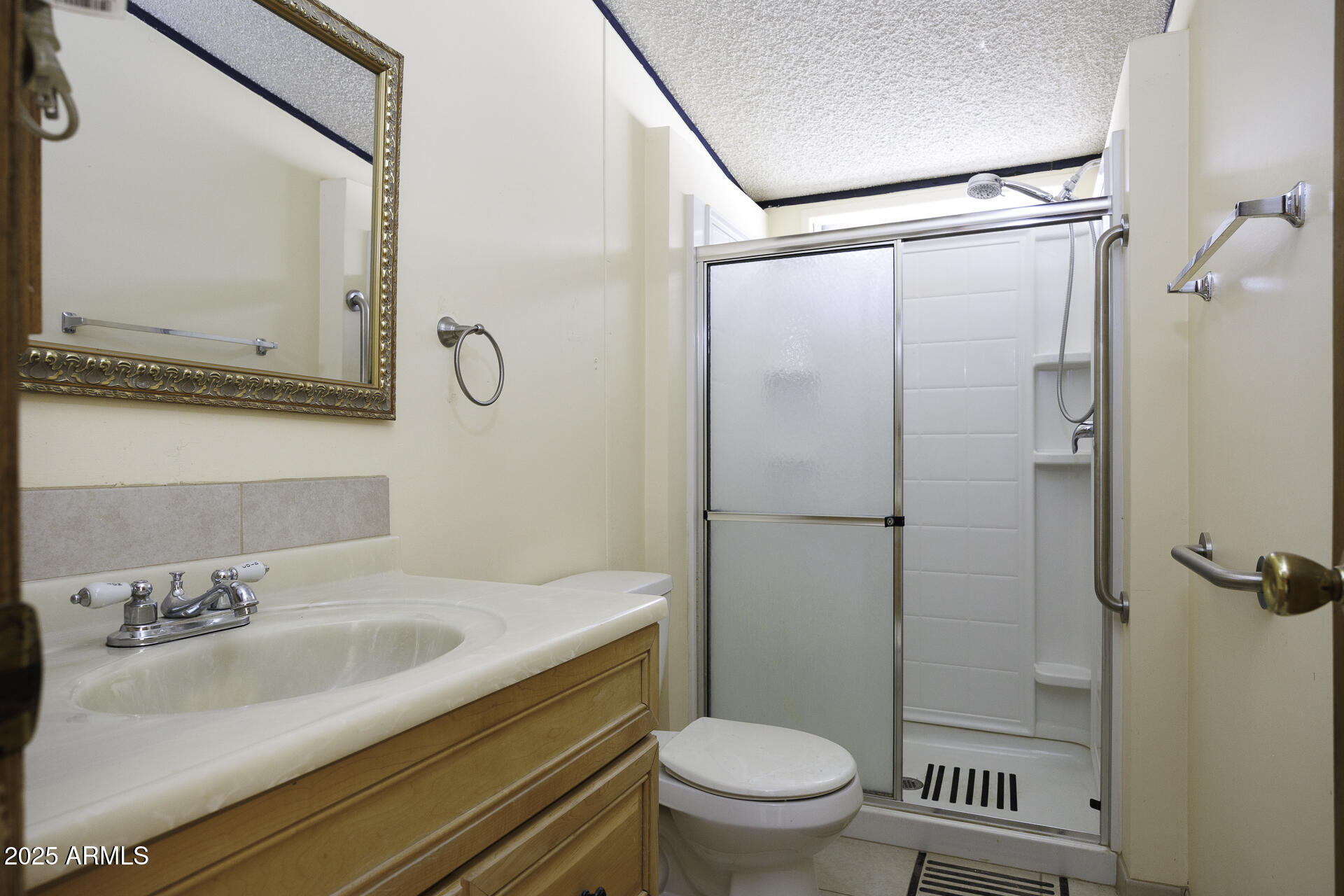 9505 West Milligan Road Arizona City, AZ 85123 - Photo 23 of 45 a bathroom with a sink toilet and shower
