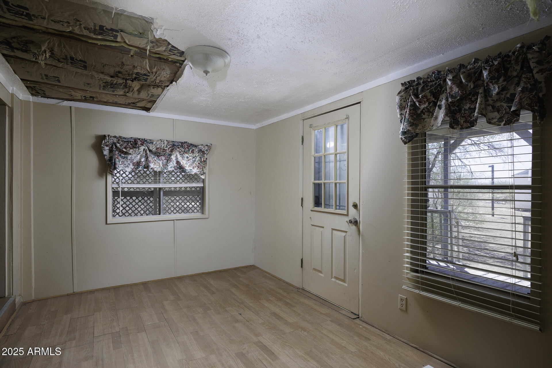 9505 West Milligan Road Arizona City, AZ 85123 - Photo 26 of 45 a view of an empty room with a window