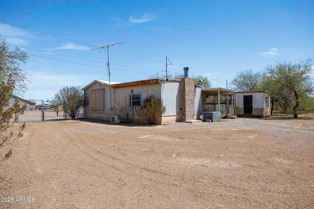 a view of a house with a snow in the yard