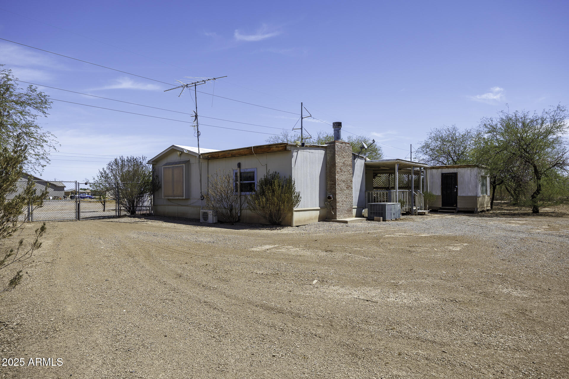 9505 West Milligan Road Arizona City, AZ 85123 - Photo 28 of 45 a view of a house with palm trees