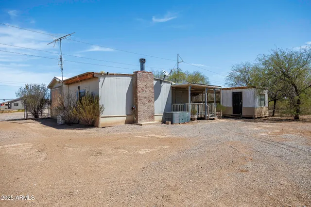 a view of a porch with wooden floor and outdoor space