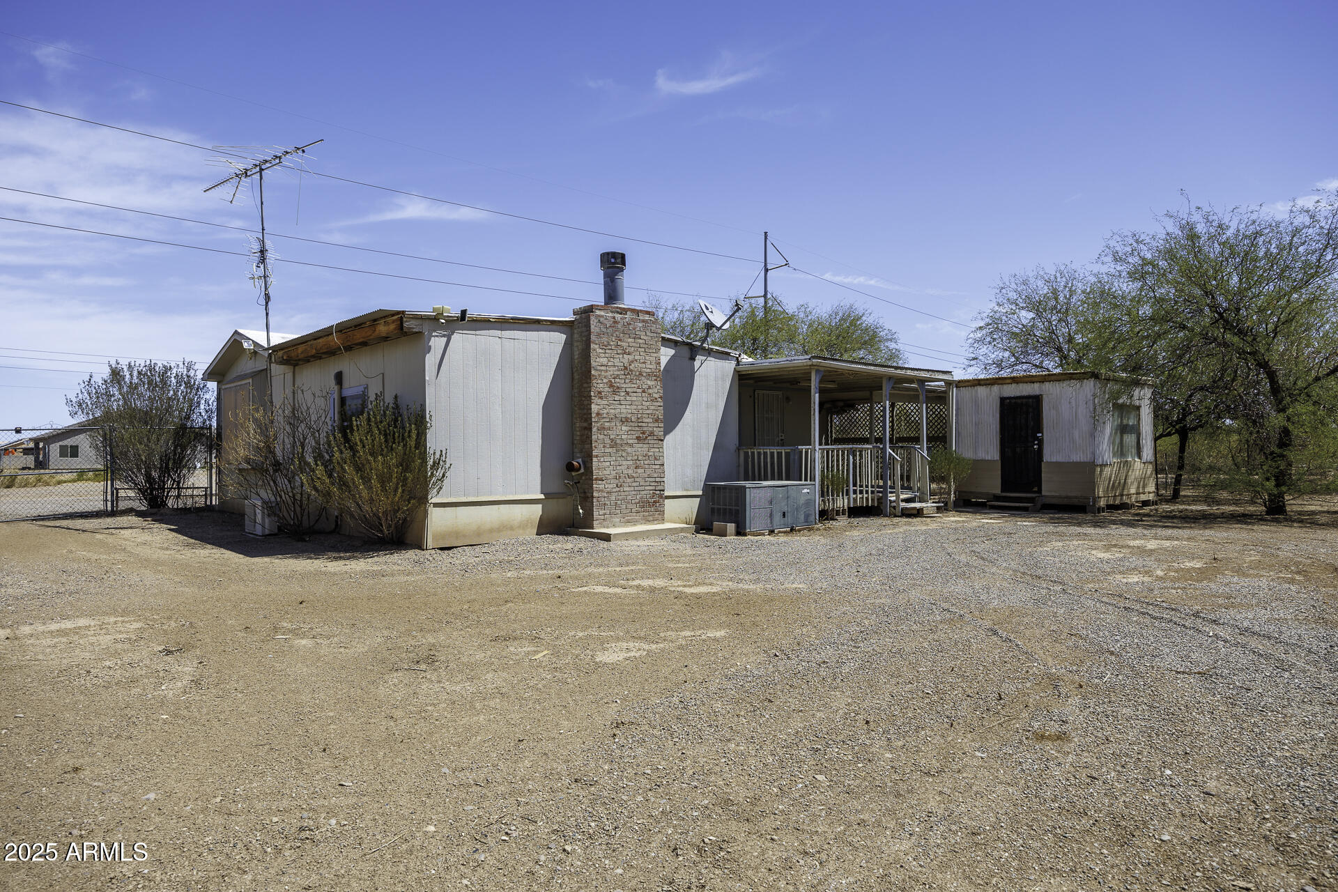 9505 West Milligan Road Arizona City, AZ 85123 - Photo 29 of 45 a view of a house with a snow in the yard