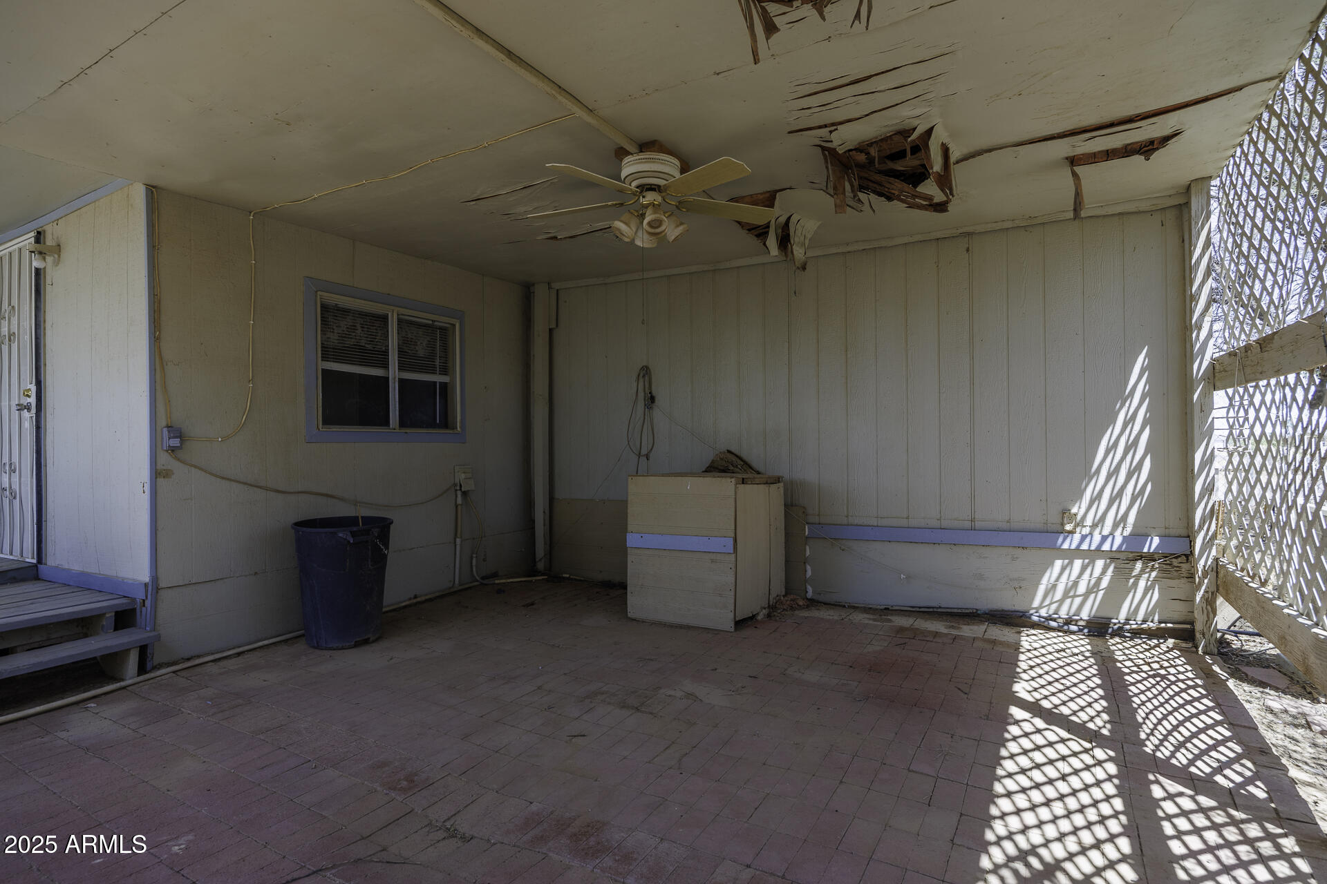 9505 West Milligan Road Arizona City, AZ 85123 - Photo 32 of 45 a view of a livingroom with furniture and a ceiling fan