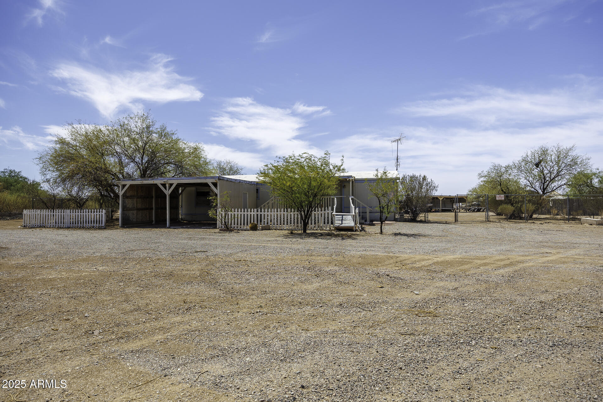 9505 West Milligan Road Arizona City, AZ 85123 - Photo 4 of 45 a view of a town with big trees