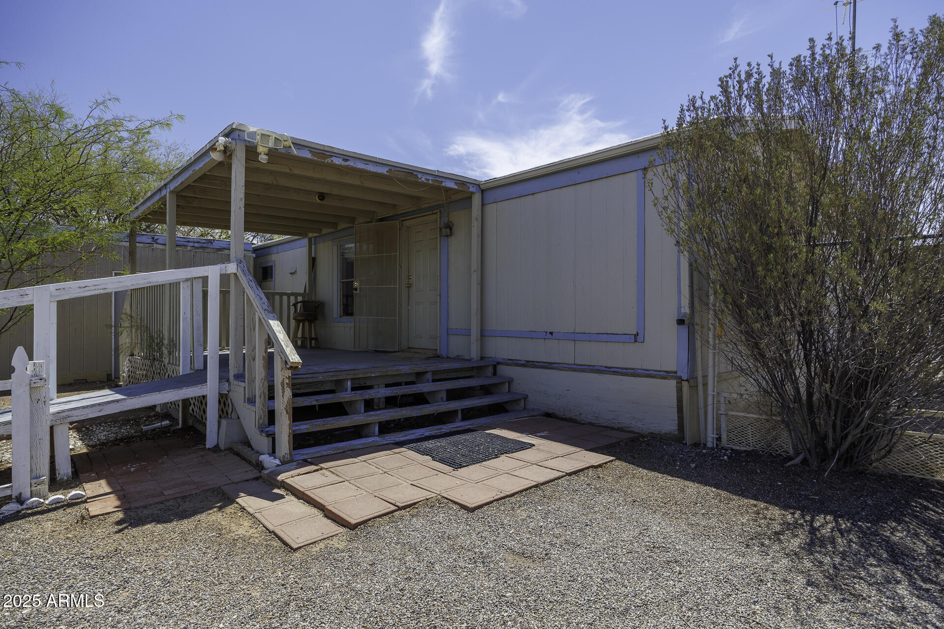 9505 West Milligan Road Arizona City, AZ 85123 - Photo 6 of 45 a front view of a house with a yard