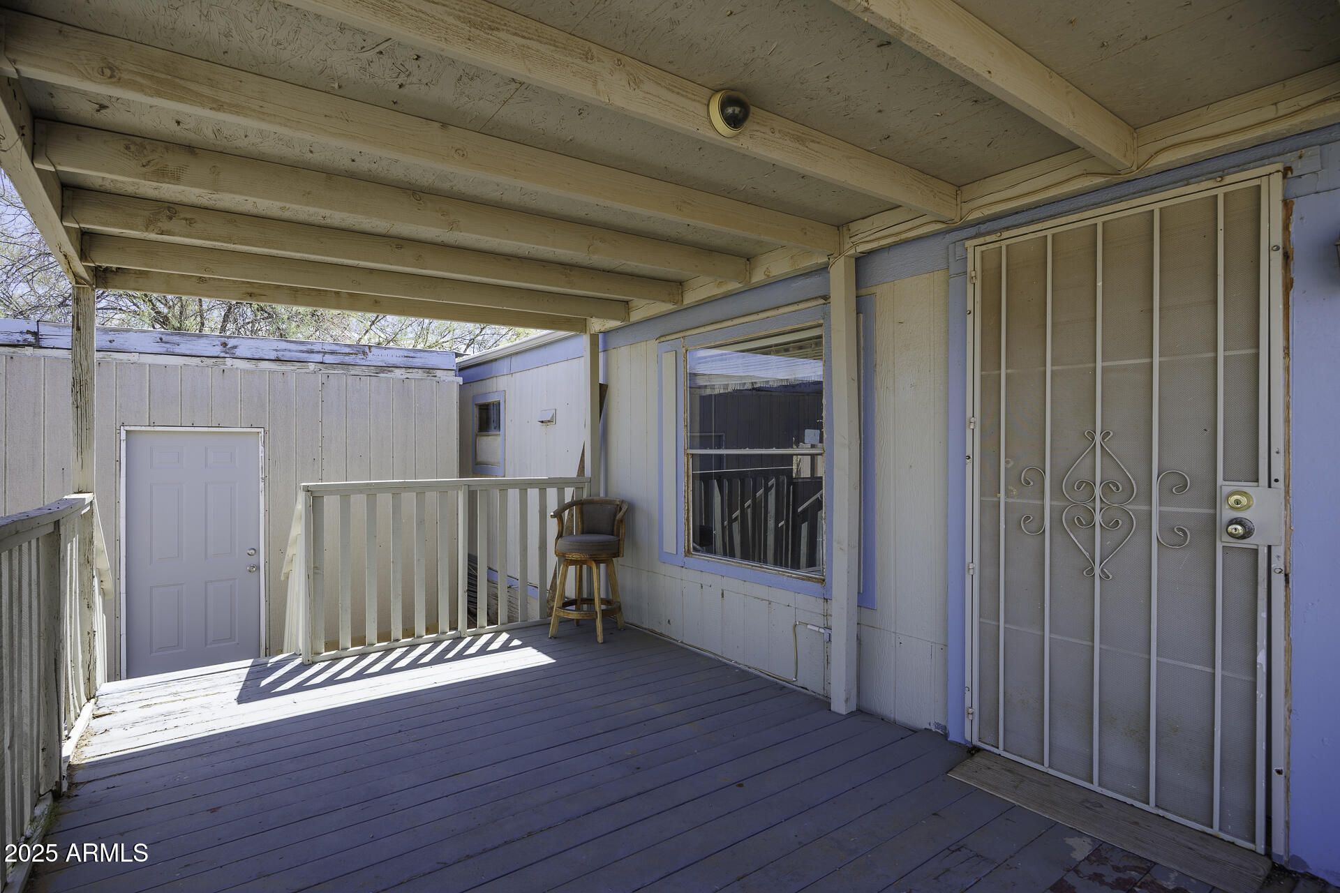 9505 West Milligan Road Arizona City, AZ 85123 - Photo 7 of 45 a view of empty room with wooden floor and fan