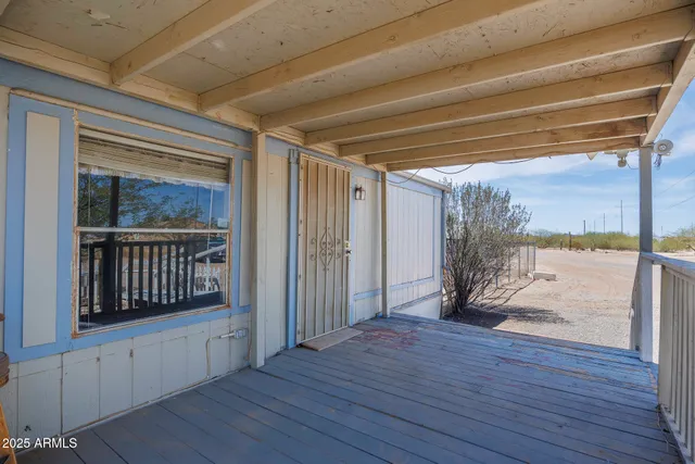 a view of a kitchen with a sink and a window