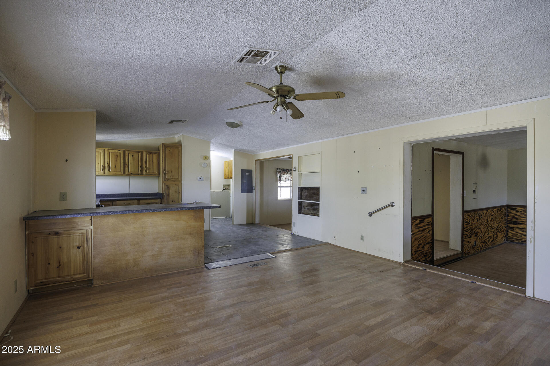 9505 West Milligan Road Arizona City, AZ 85123 - Photo 9 of 45 a view of a kitchen with a sink and a window