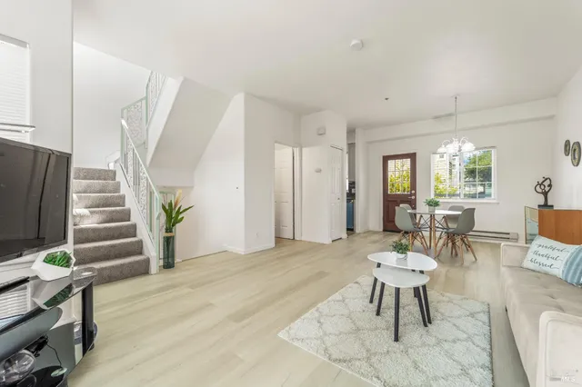 a view of a livingroom with furniture and wooden floor