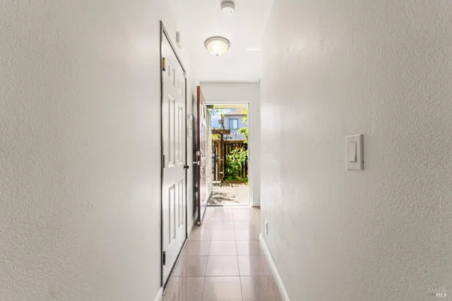 a view of a hallway with a white walls