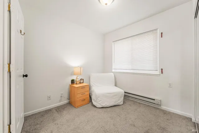 a room with a bed and a window