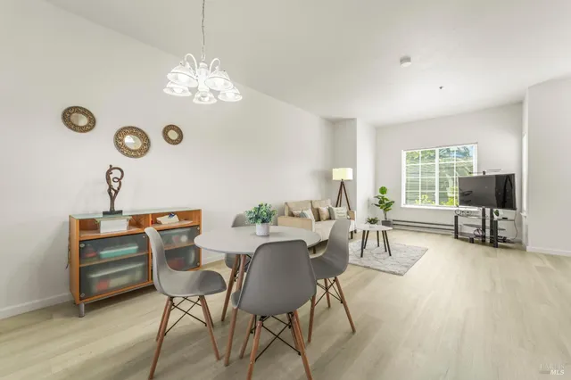 a view of a dining room with furniture window and outside view