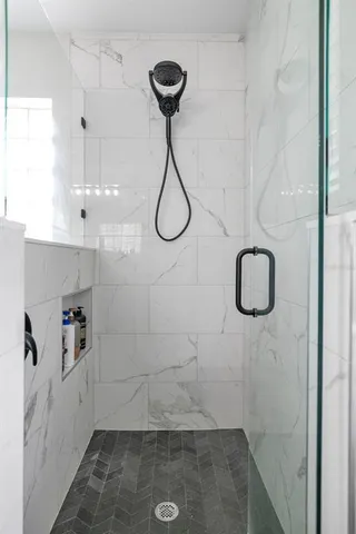 a view of a dining room with furniture wooden floor and chandelier