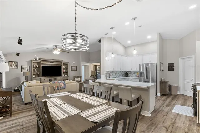 a living room with furniture window and wooden floor