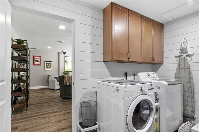 a front view of a house with a garden and yard