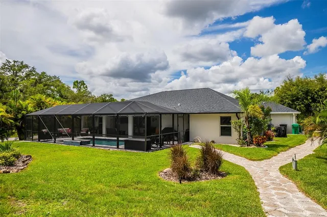 a view of a big house with a big yard