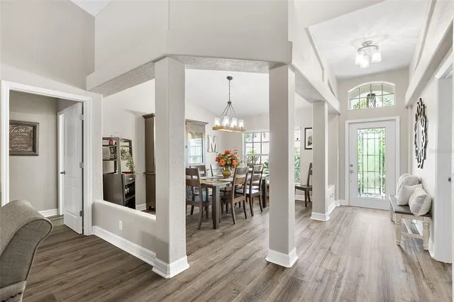a view of a dining room with furniture and wooden floor