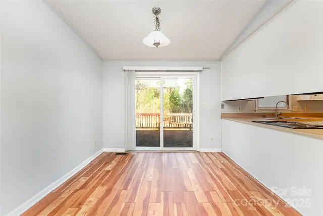 a view of a kitchen from the hallway
