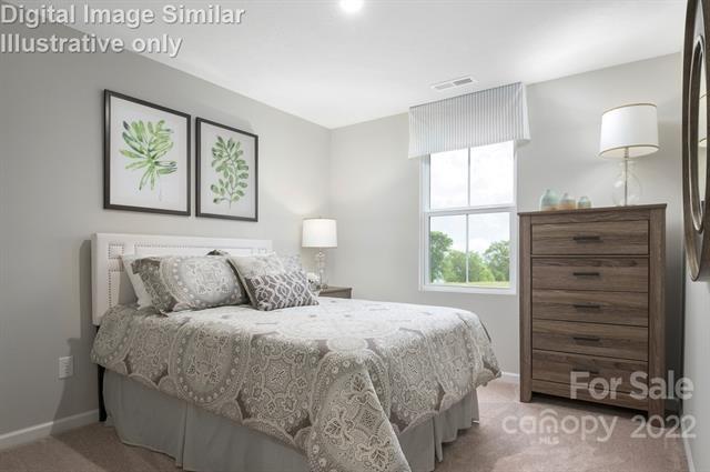 117 Hackamore Road, Unit 208 Troutman, NC 28166 - Photo 16 of 17 a bedroom with a bed and a window