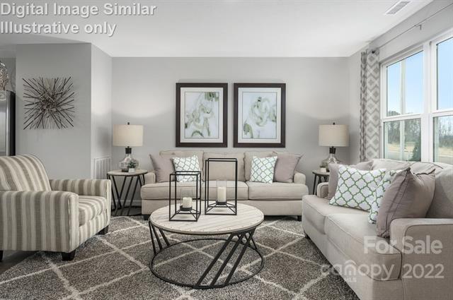 117 Hackamore Road, Unit 208 Troutman, NC 28166 - Photo 6 of 17 a living room with furniture and a large window