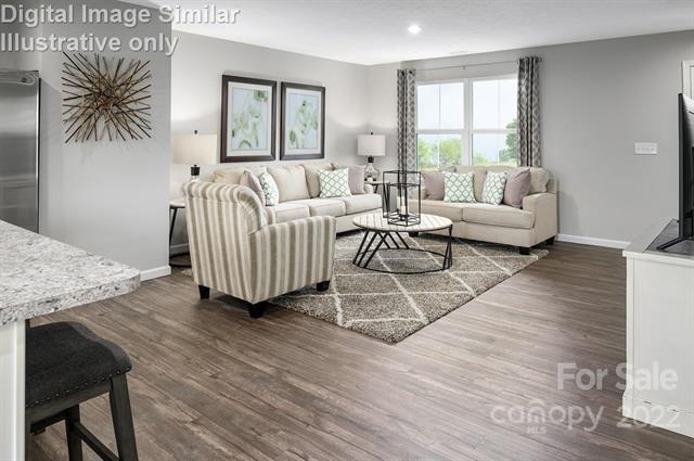 117 Hackamore Road, Unit 208 Troutman, NC 28166 - Photo 7 of 17 a living room with furniture and a large window