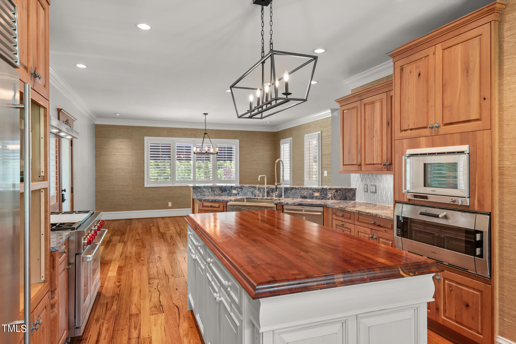 1936 Amethyst Ridge Road Raleigh, NC 27604 - Photo 13 of 74 a room with wooden floor pool table and chairs