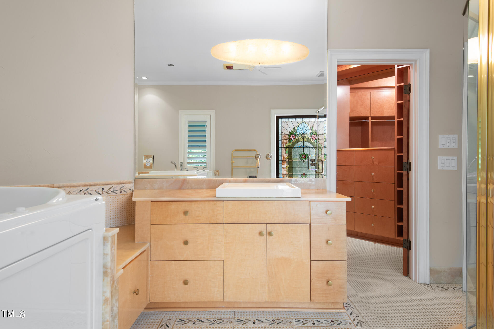 1936 Amethyst Ridge Road Raleigh, NC 27604 - Photo 31 of 74 a bathroom with a sink a vanity and a mirror