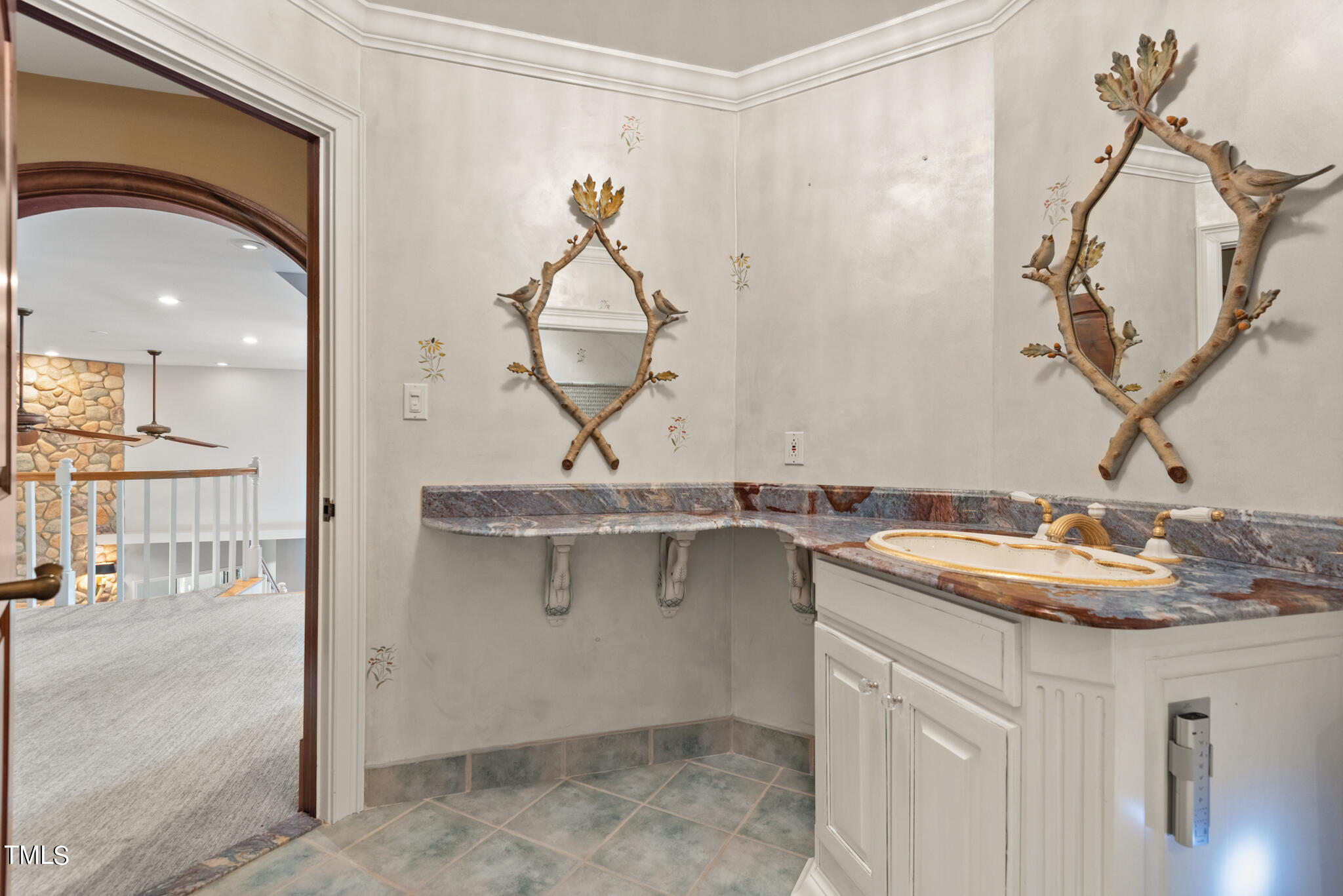 1936 Amethyst Ridge Road Raleigh, NC 27604 - Photo 35 of 74 a bathroom with a sink and a mirror