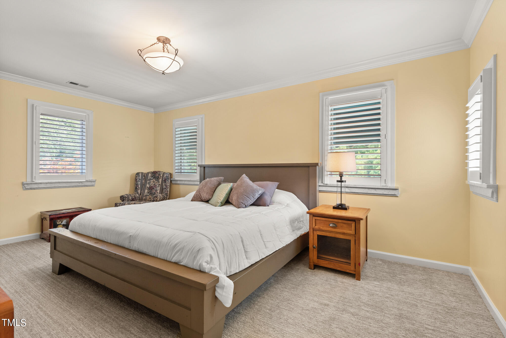 1936 Amethyst Ridge Road Raleigh, NC 27604 - Photo 38 of 74 a bedroom with a bed and a window