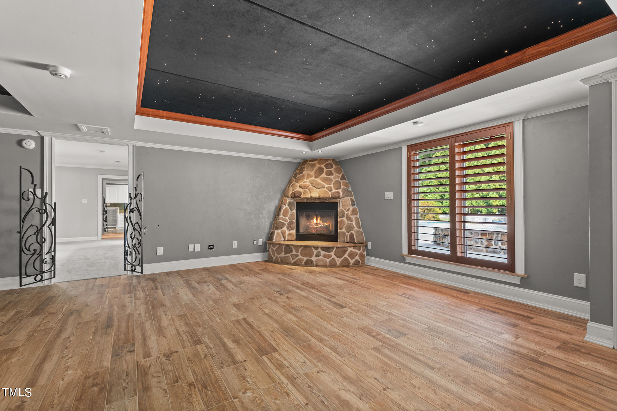 1936 Amethyst Ridge Road Raleigh, NC 27604 - Photo 45 of 74 a big room with wooden floor and windows