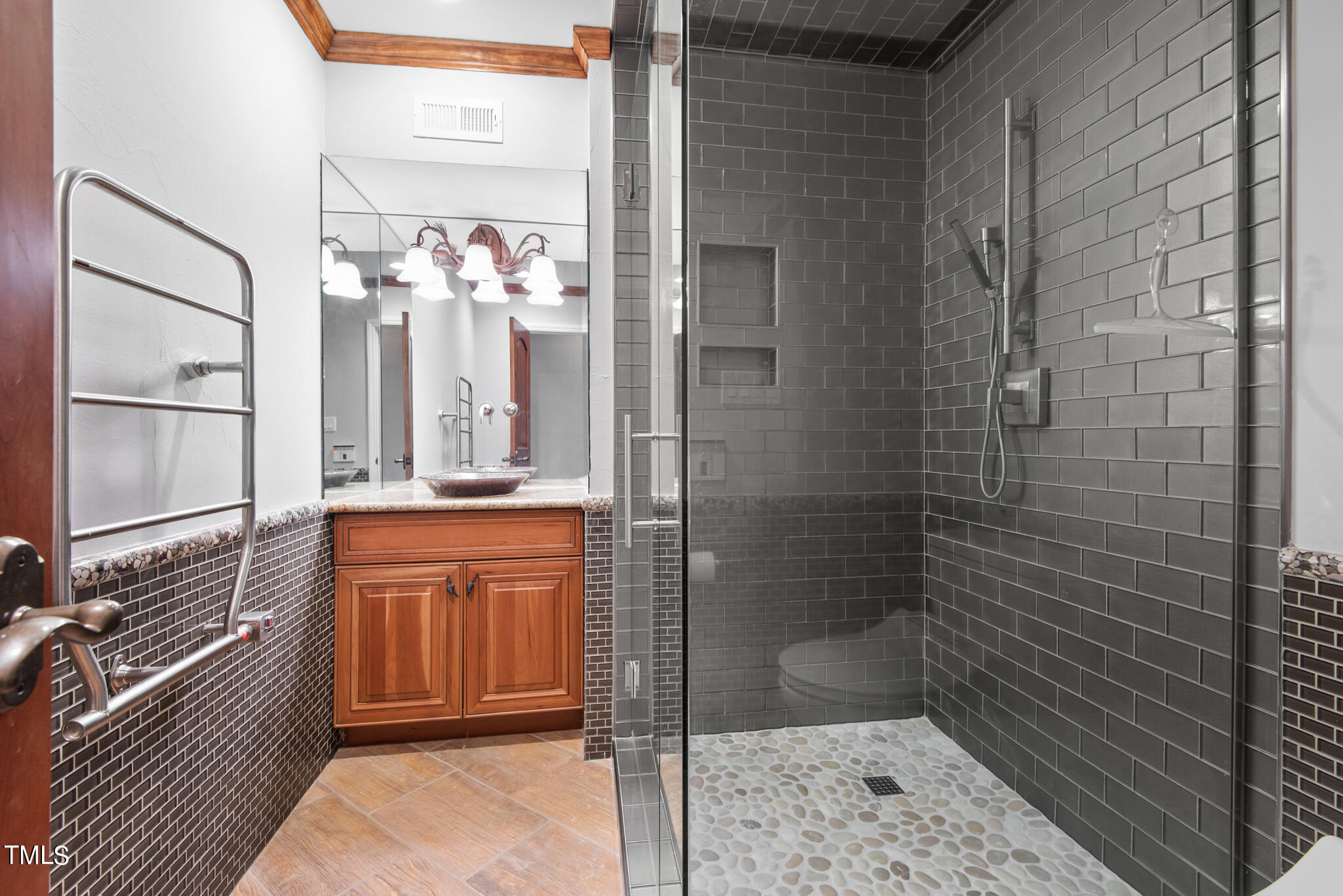 1936 Amethyst Ridge Road Raleigh, NC 27604 - Photo 47 of 74 a bathroom with a mirror and a shower