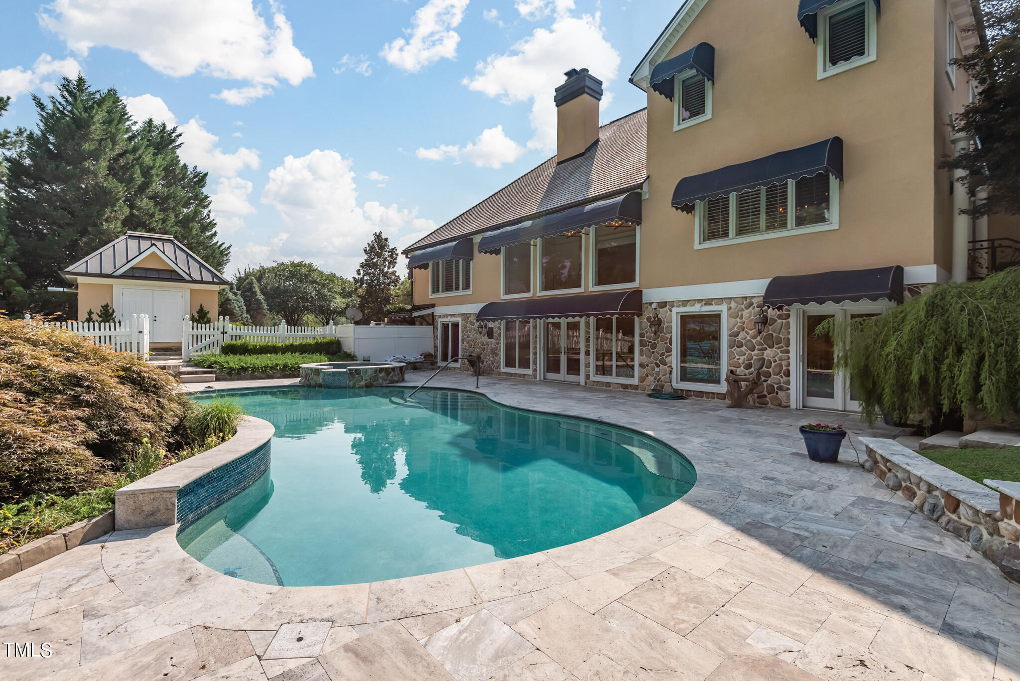 1936 Amethyst Ridge Road Raleigh, NC 27604 - Photo 55 of 74 a view of a house with swimming pool and sitting area
