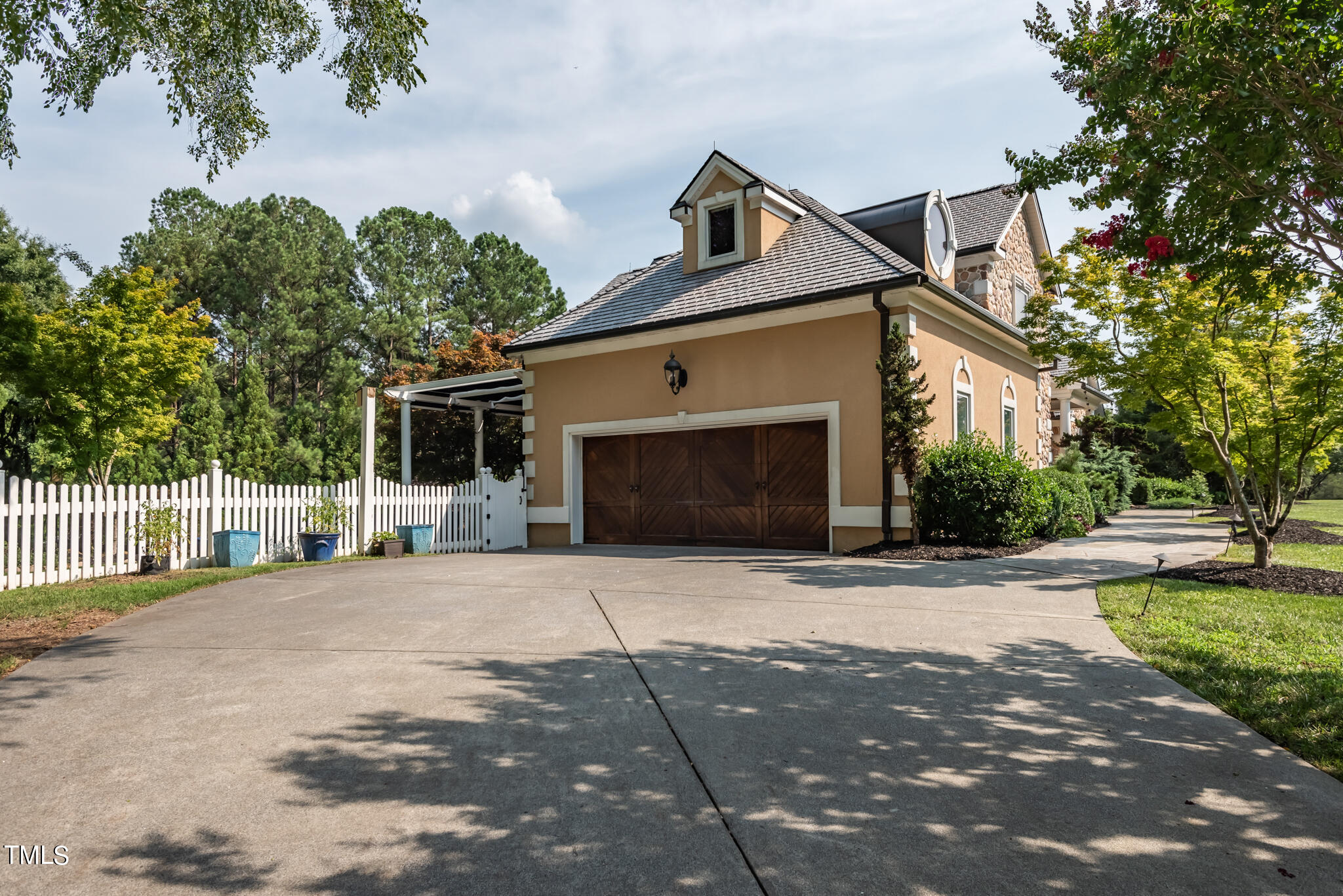 1936 Amethyst Ridge Road Raleigh, NC 27604 - Photo 63 of 74 a front view of a house with a yard and a garage