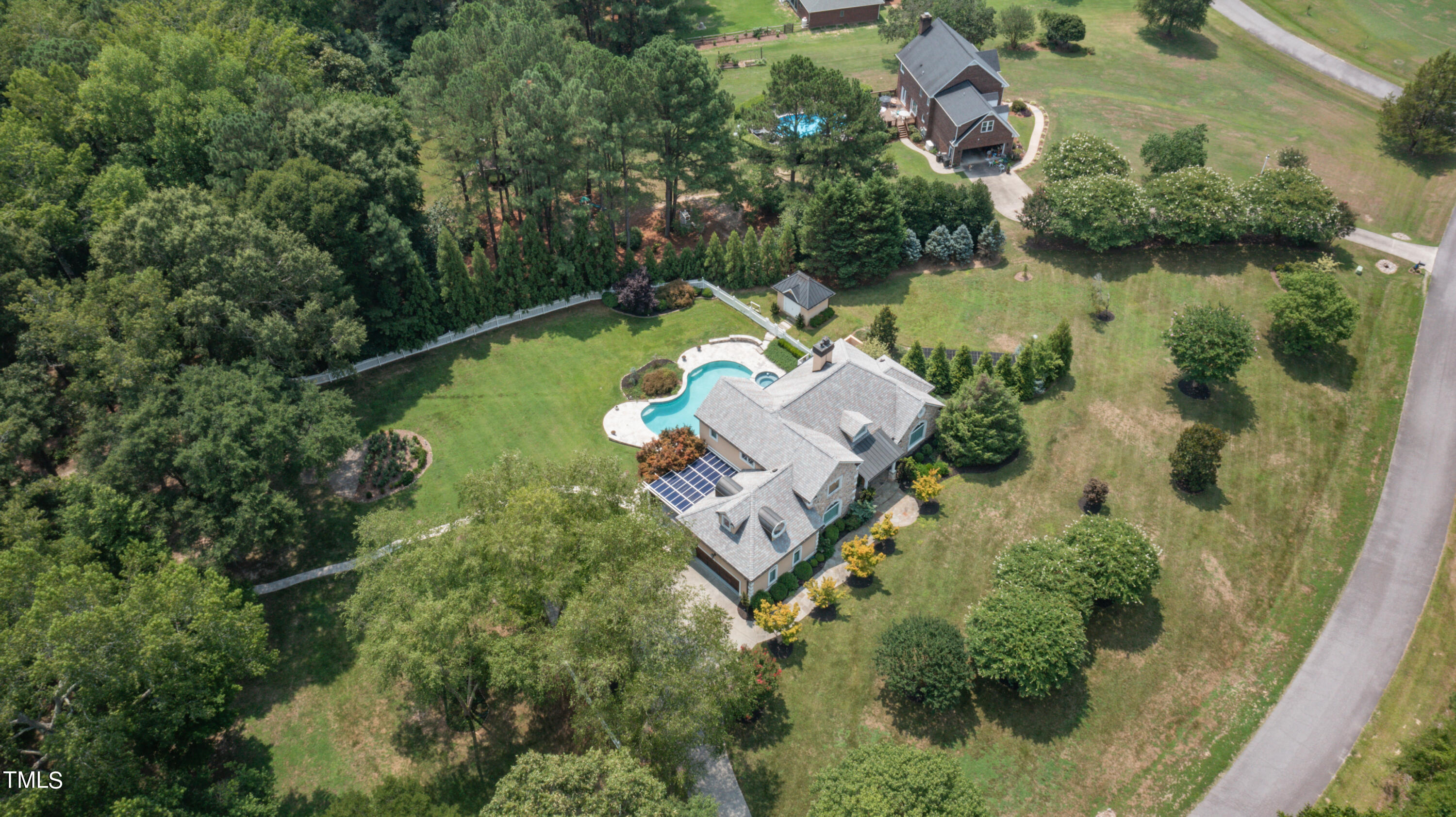 1936 Amethyst Ridge Road Raleigh, NC 27604 - Photo 67 of 74 an aerial view of a house with a garden and lake view