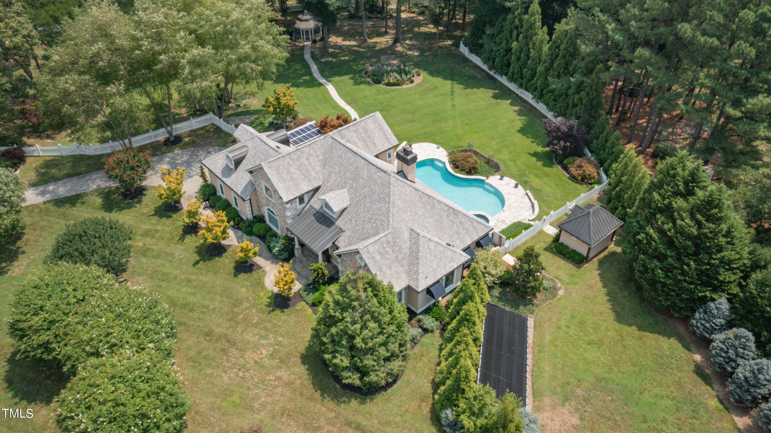 1936 Amethyst Ridge Road Raleigh, NC 27604 - Photo 71 of 74 an aerial view of a house with a garden and swimming pool