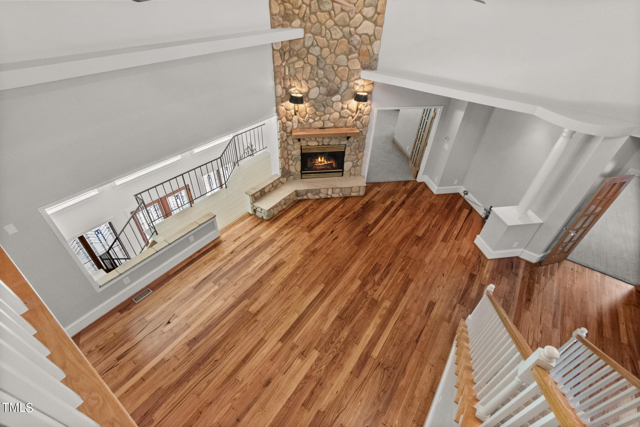 1936 Amethyst Ridge Road Raleigh, NC 27604 - Photo 8 of 74 a view of stairs and a fireplace
