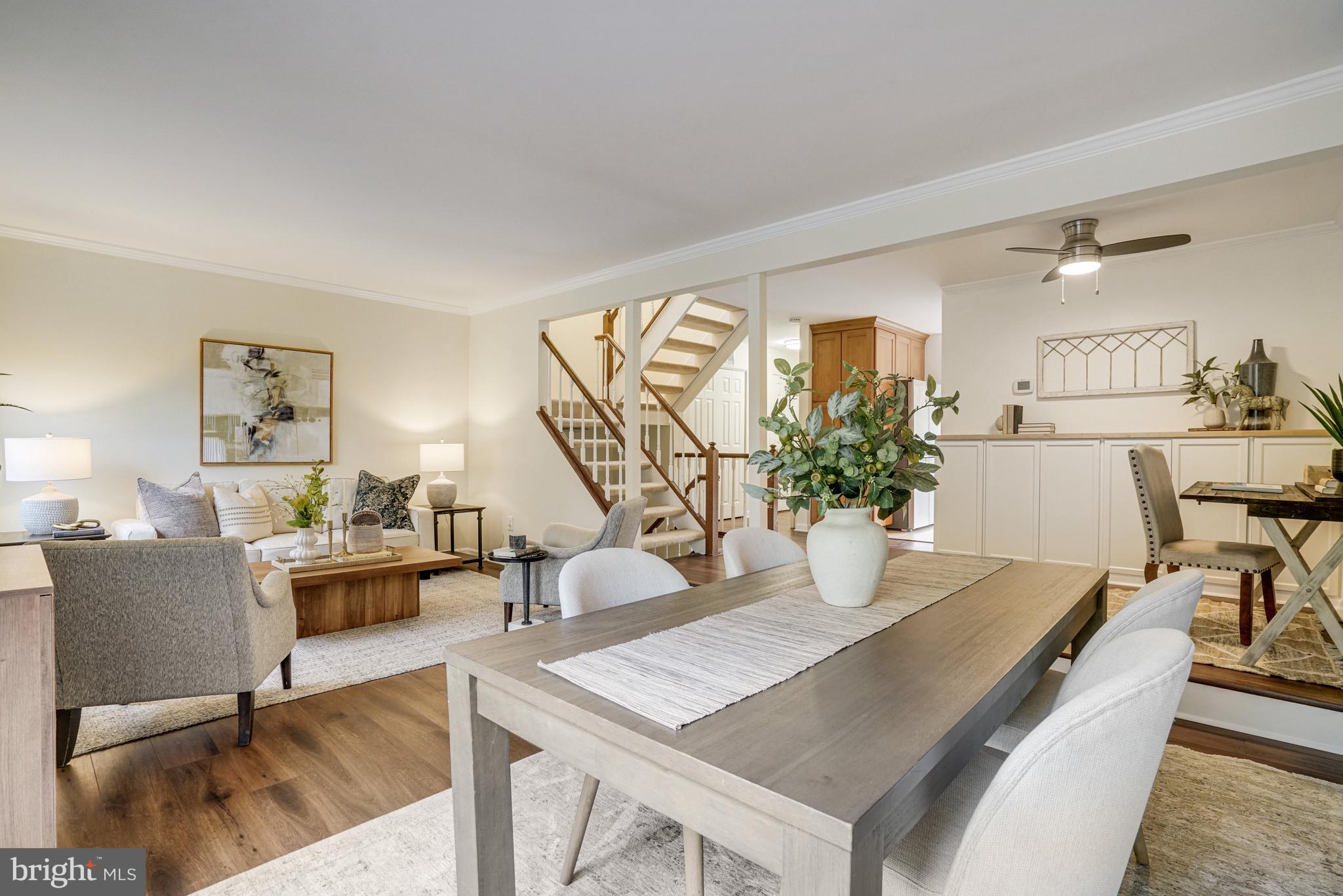 2266 Cartbridge Road Falls Church, VA 22043 - Photo 10 of 48 a view of a dining room with furniture and a potted plant
