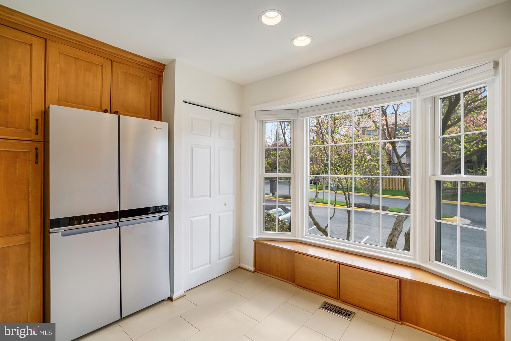 2266 Cartbridge Road Falls Church, VA 22043 - Photo 16 of 48 a living room with a large window and refrigerator