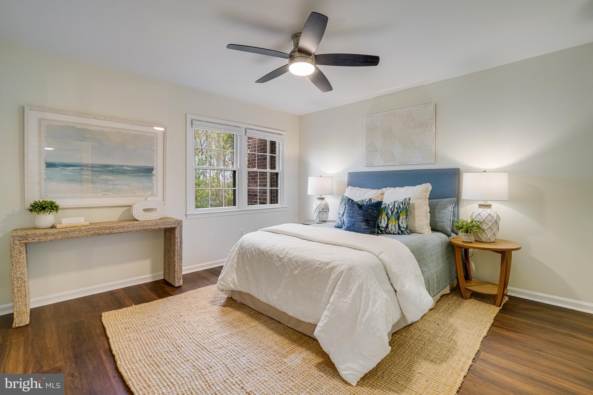 2266 Cartbridge Road Falls Church, VA 22043 - Photo 20 of 48 a bedroom with a large bed and a chandelier