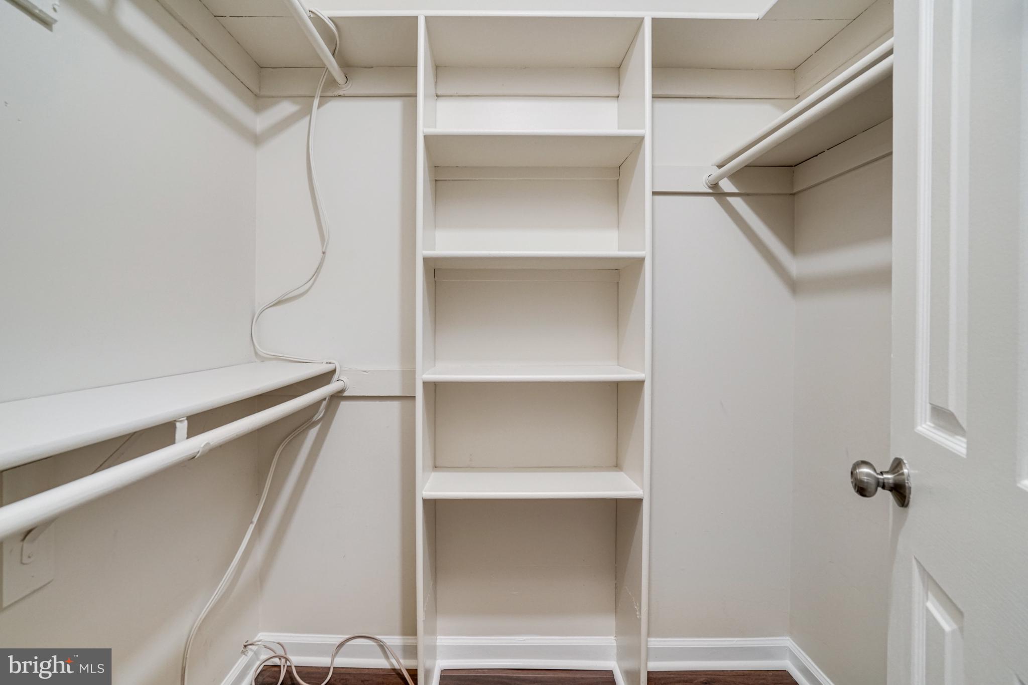 2266 Cartbridge Road Falls Church, VA 22043 - Photo 30 of 48 a view of walk in closet with empty racks