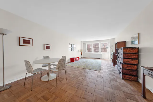 a living room with furniture and a window