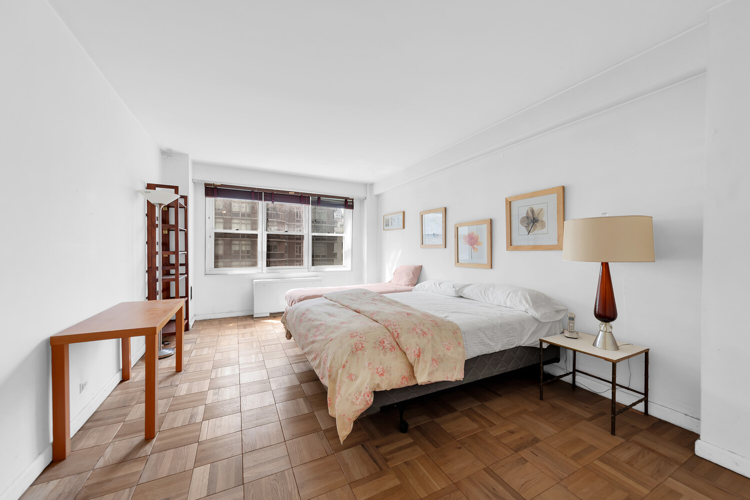 205 East 63rd Street, Unit 6G Manhattan, NY 10065 - Photo 4 of 6 a bedroom with a bed and a window