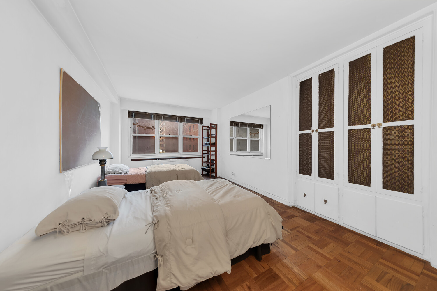 205 East 63rd Street, Unit 6G Manhattan, NY 10065 - Photo 5 of 6 a bedroom with a bed and a window