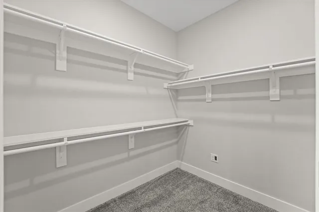 a bathroom with a granite countertop sink and mirror