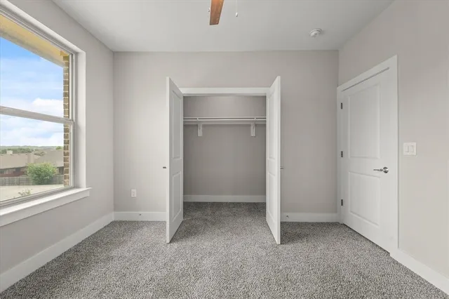 a bathroom with a granite countertop sink a toilet and bathtub